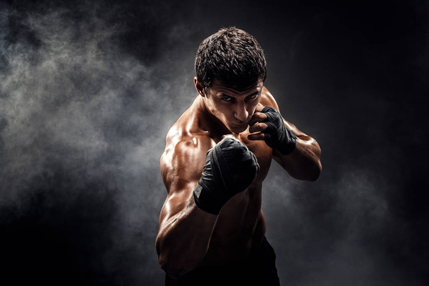 Muscular topless fighter in boxing gloves - Photo, image