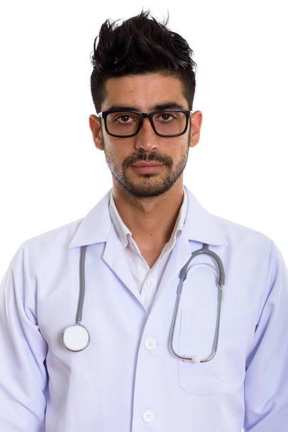 Studio shot of young Persian man doctor wearing eyeglasses - Valokuva, kuva