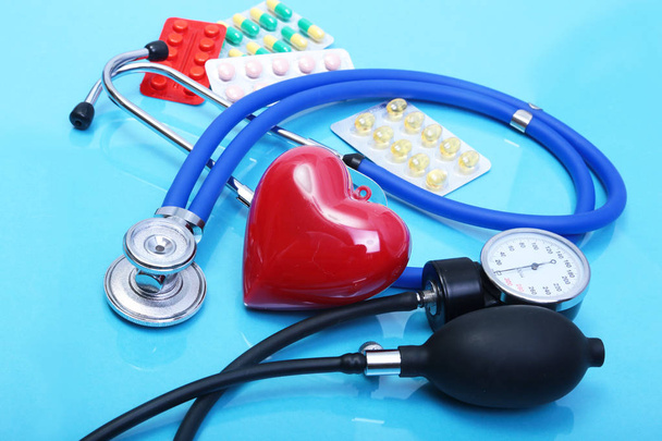 Stethoscope and medical equipmenton on blue background - Фото, изображение