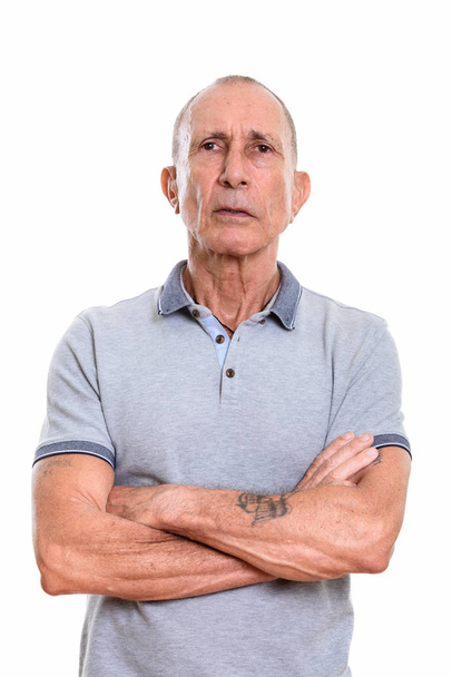 Studio shot of senior man with arms crossed - Foto, Imagem