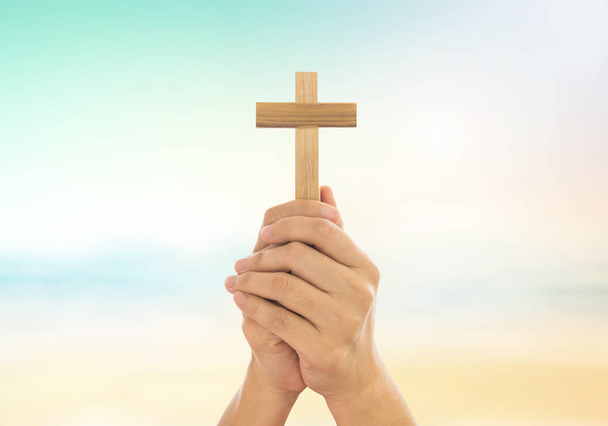 Human hands holding a cross  - Photo, Image