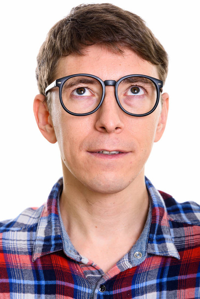 Face of man thinking while wearing eyeglasses  - Photo, Image