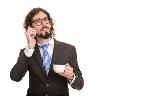 Hermoso hombre de negocios caucásico hablando por teléfono móvil y Holdi
 - Foto, imagen