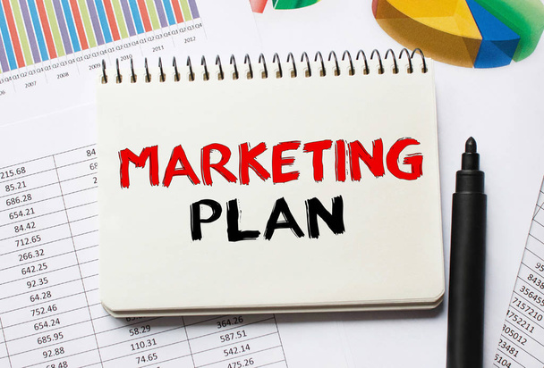 Notebook with Toolls and Notes about Marketing Plan - Photo, image