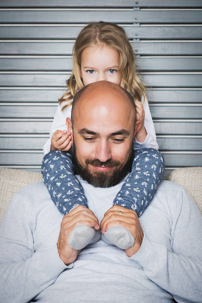 Happy family concept, father and daughter portrait, sitting on a couch having fun - Fotoğraf, Görsel