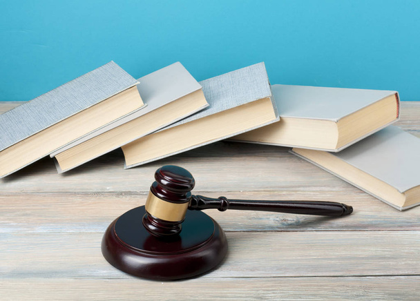 Law concept - Books with wooden judges gavel on table in a courtroom or enforcement office.Copy space for text. - 写真・画像