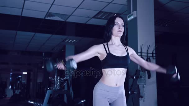 sports girl does exercises with dumbbells - Footage, Video