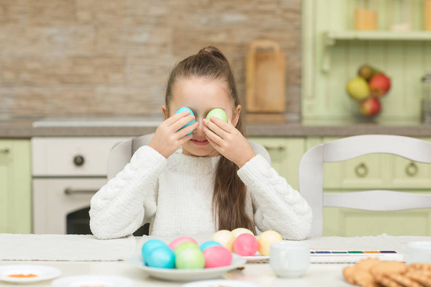 Funny little girl with two Easter eggs - Photo, Image