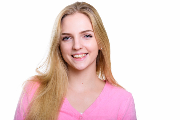 Студійний знімок молодої щасливої дівчини-підлітка, яка посміхається
 - Фото, зображення