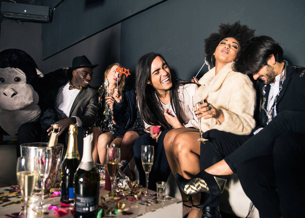 Friends having party in nightclub   - Foto, afbeelding