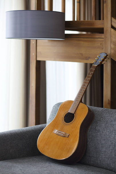 Cozy living room with guitar  - Foto, afbeelding