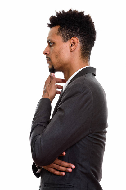 Profile view of young African businessman thinking  - Fotó, kép