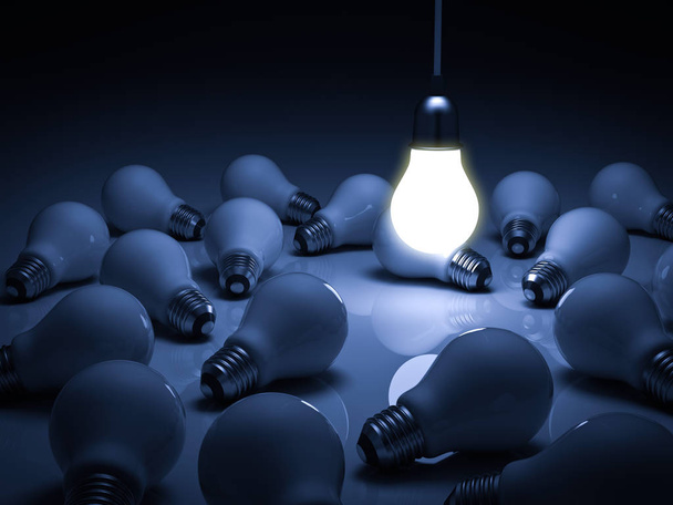 One glowing hanging light bulb standing out from the unlit dead incandescent bulbs with reflection , leadership and different business creative idea concept - Photo, Image