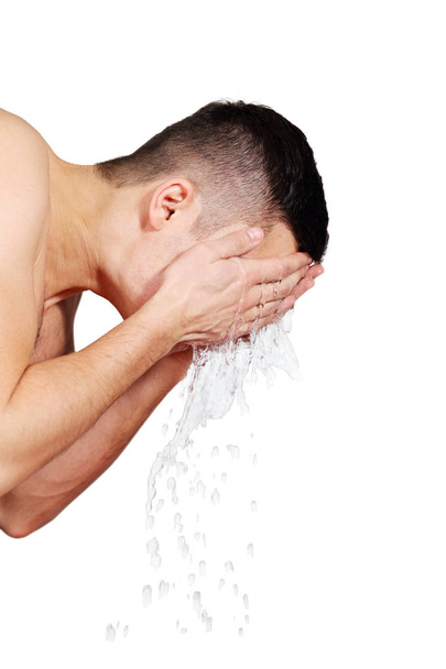 A man washes his face with water - Φωτογραφία, εικόνα