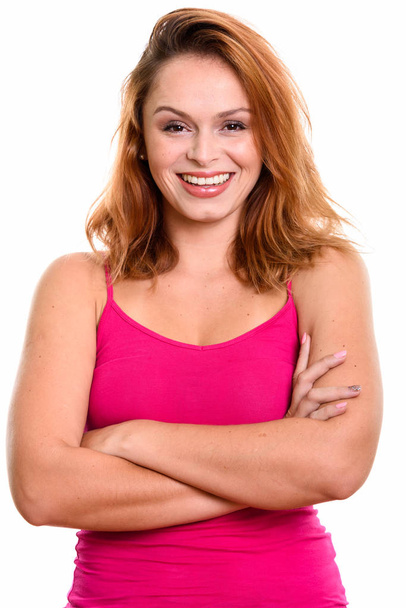 Studio shot of young happy Brazilian woman smiling with arms cro - Foto, Bild