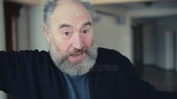 Old man shows winning emotions in 4K - Felvétel, videó