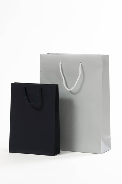 Silver and black paper bag on a white background - Foto, afbeelding