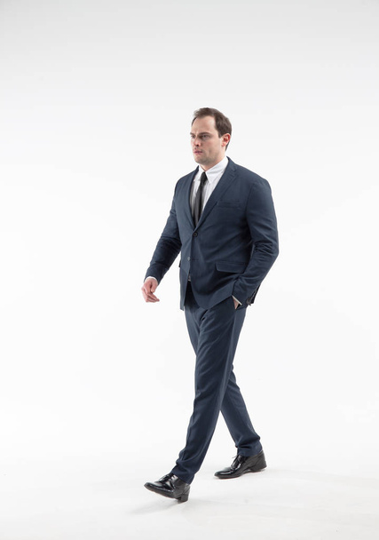 Portrait of walking mature businessman isolated on white background - Foto, imagen