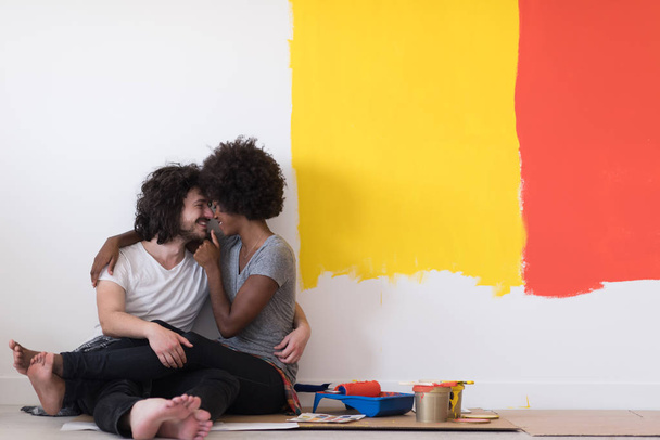 young multiethnic couple relaxing after painting - Foto, immagini