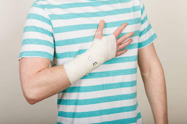 Part body man with bandaged hand. - Fotografie, Obrázek
