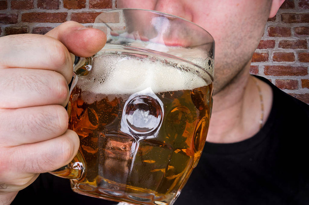 Man is drinking beer in a pub - Foto, imagen