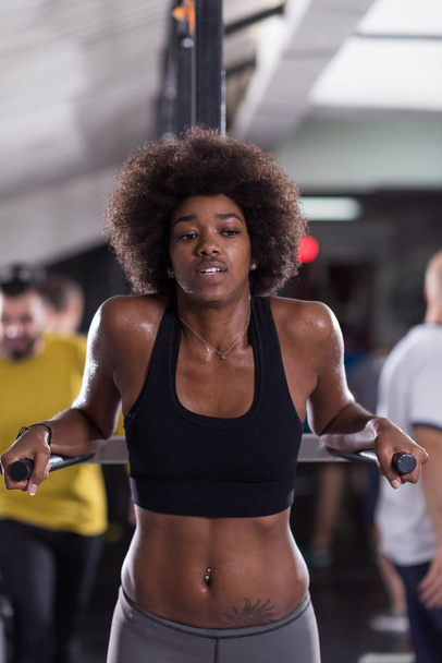 black woman doing parallel bars Exercise - 写真・画像