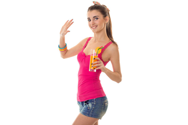 summertime portrait of young beautiful brunette woman with cocktail in her hands posing isolated on white background - Foto, Bild