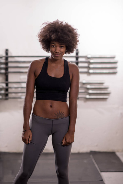 black woman after a workout at the gym - Photo, Image