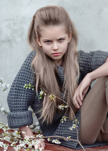 portrait of little girl outdoors in spring;  - Fotó, kép