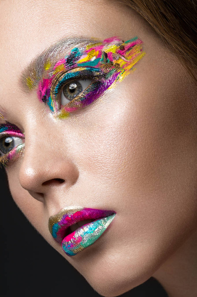 Beautiful girl with creative colorful makeup. Beauty face. - Photo, Image