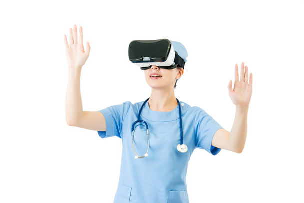 asian female surgeon control screen by VR headset - Фото, изображение