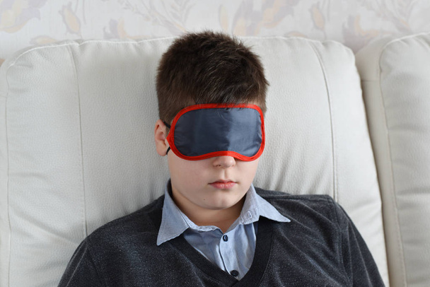 Teen rest during the day in mask for sleep - Fotografie, Obrázek