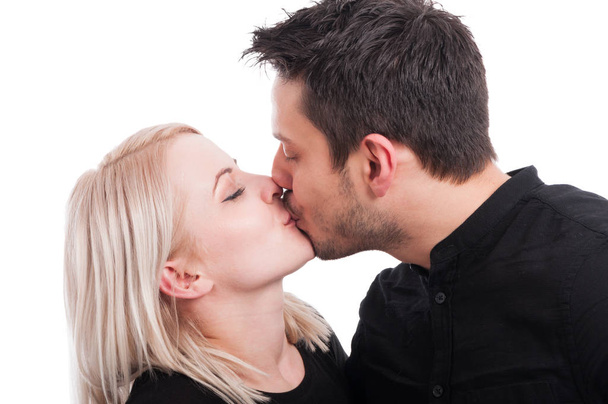 Close-up of pretty girl kissing handsome boy - Foto, Bild