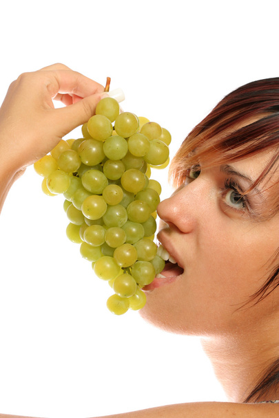 Girl with a cluster of green grapes - Foto, immagini