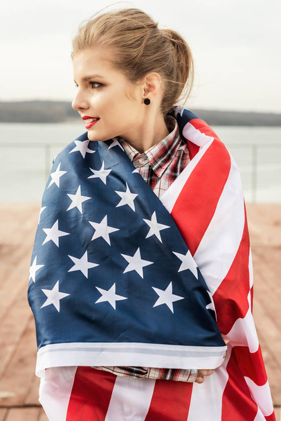 young beautiful woman holding USA flag - Φωτογραφία, εικόνα