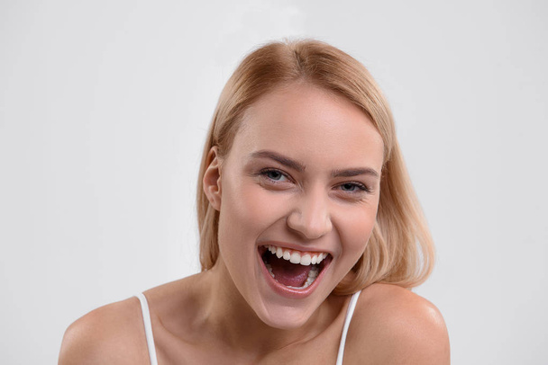 Happy young woman smiling with joy - 写真・画像