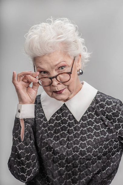 Middle aged female with skeptical expression on her face - Fotografie, Obrázek
