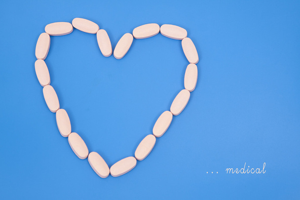 Pills on a blue background - Photo, Image