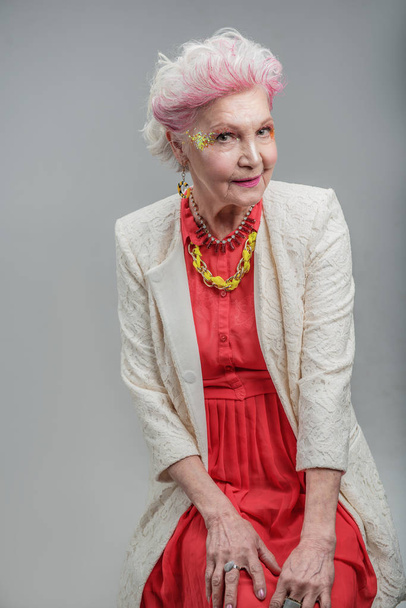 Modern old lady with bright makeup - Фото, изображение