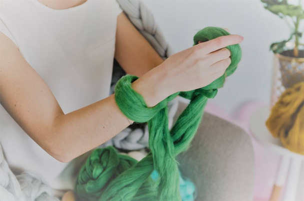 young woman kniting merino wool with hands - Zdjęcie, obraz