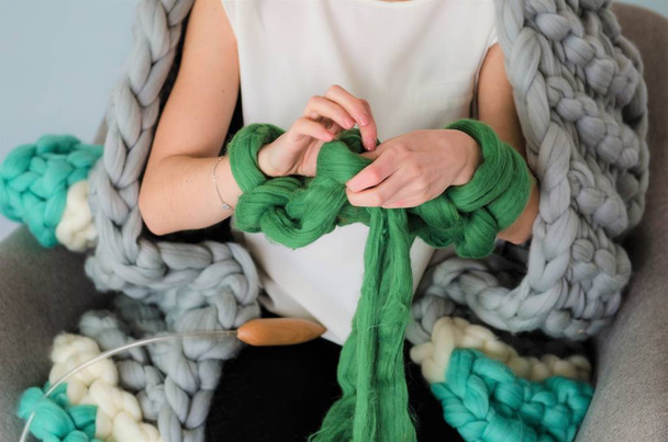 young woman kniting merino wool with hands - Foto, Imagem