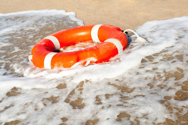 Lifebuoy on the sea shore close up - Photo, Image
