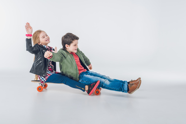 Boy and girl with skateboard - Zdjęcie, obraz