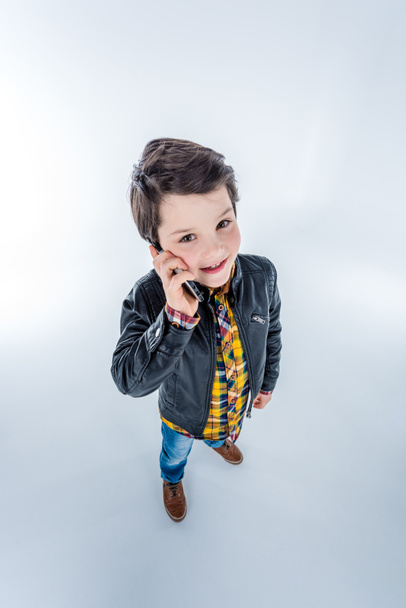 Boy talking on smartphone - Foto, Imagen