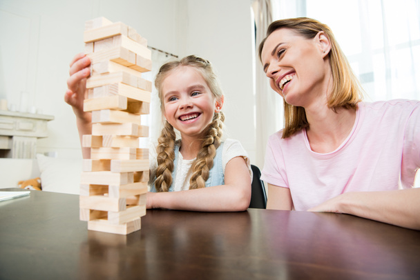 Mother and daughter playing jenga game  - Fotografie, Obrázek