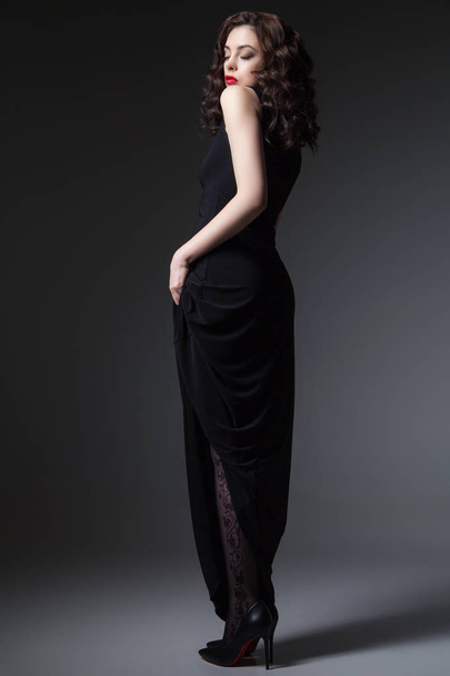 Attractive female in black dress - Fotó, kép