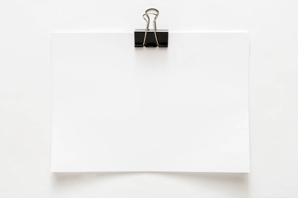 Blank paper sheet attached with clip isolated on white background - Fotoğraf, Görsel