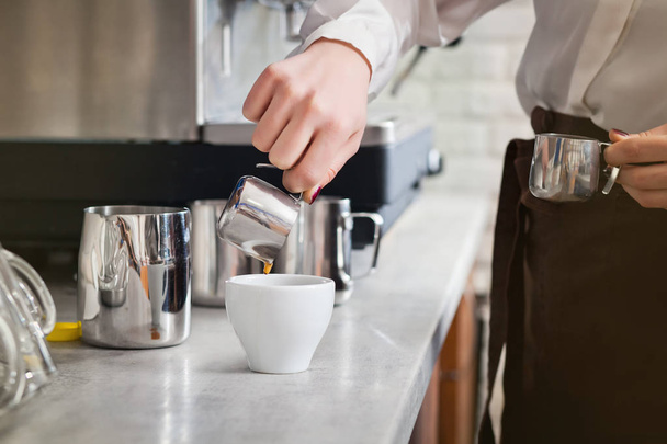 barista is preparing coffee on coffee machine - Фото, изображение