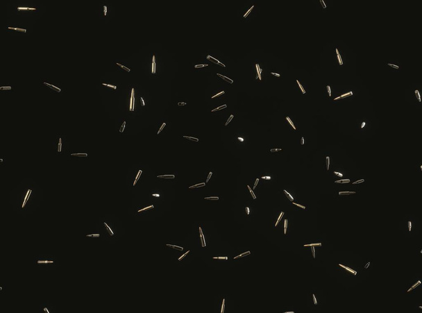 Balles de fusil flottant sur fond noir
 - Photo, image