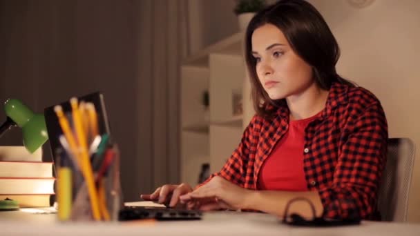 student or woman typing on laptop at night home - Filmmaterial, Video